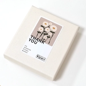 Minimalist cactus thank you stickers on cream gift box with luxury leather texture