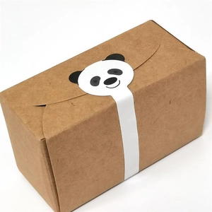 Close-up of cute panda long sticker sealing a kraft paper gift box for bakery packaging