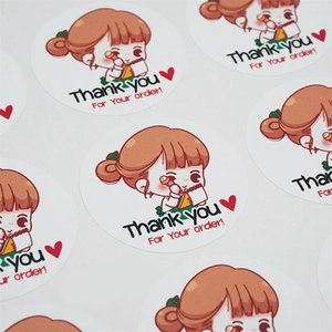 Macro view of cute cartoon girl thank you stickers for gift packaging and seal