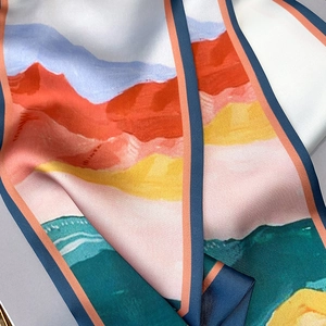 Detail of artistic oil painting print silk scarf with vibrant orange edge finish