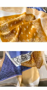 Detailweergave van zijden sjaal met paisley-print, hoogwaardige naden en satijn-look