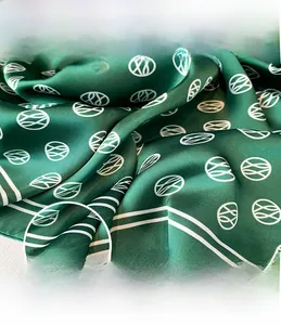 Detail of forest green satin scarf showing precision stitching and fine edge sewing