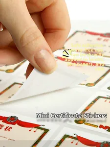 Detailed view of hand peeling cartoon reward stickers for school children and teachers