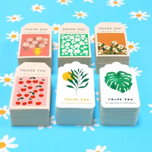 Detail showing six floral and fruit patterns for small business thank you gift tags