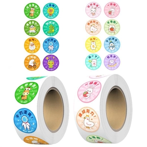 Close-up of two rolls of cartoon animal reward stickers with colorful panda and lion motifs