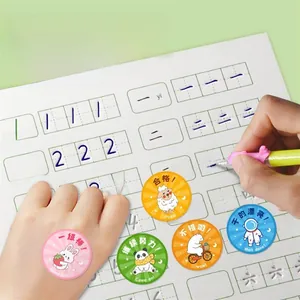 Close-up of colorful round reward stickers with cartoon animals on a calligraphy book