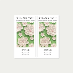 Detailed macro view of oil painting style floral thank you cards with embossed texture