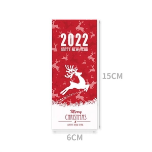 Detail showing red and white Merry Christmas labels with 15cm height dimensions