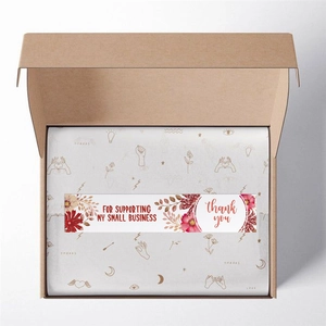 Florale rechteckige Dankeschön-Aufkleber auf weißem Seidenpapier in einer braunen Box