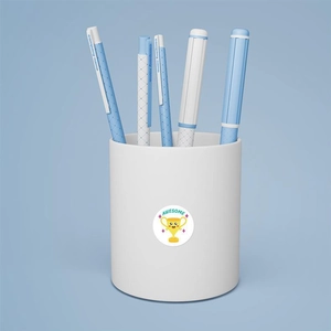 Close-up of Awesome trophy sticker on a minimalist pencil holder with blue pens