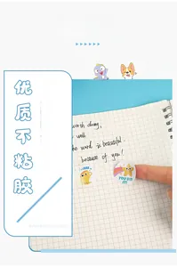 Close-up of colorful cartoon animal reward stickers applied on a grid notebook