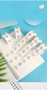 Close-up of assorted colorful cartoon reward stickers on a roll for children