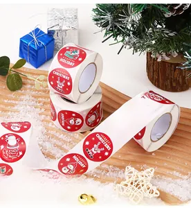Close-up of circular Christmas gift stickers with snowman and reindeer cartoon patterns