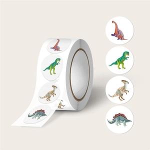Macro shot of assorted colorful cartoon dinosaur stickers in a roll for children