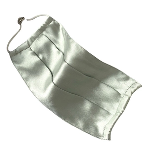Breathable silk face mask in light green with adjustable white elastic ear loops