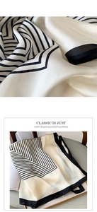 Detailed macro view and display of striped faux silk square scarf on a chair