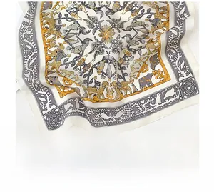 Detailed view of silk square scarf featuring retro animal and floral patterns with rolled edges