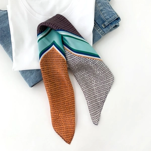 Fashionable colorful patchwork silk scarf featuring geometric patterns on a white tee