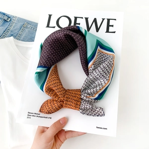Silk neck scarf with geometric patchwork pattern and brand texture in vibrant colors