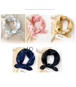 Detailed color display of silk scarves with minimalist seagull print in five elegant shades