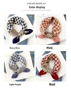 Detail of silk scarves in blue pink violet and red with houndstooth and chain pattern