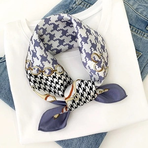 Silk neck scarf with houndstooth and floral print on white shirt and blue jeans