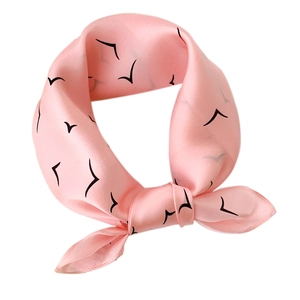 Pink silk square scarf featuring minimalist black seagull print in a knotted style