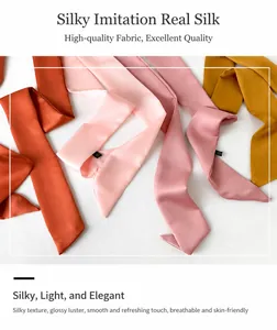 Close-up of colorful silk skinny scarves showing soft texture and neat stitching details