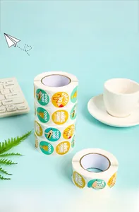 Detailed view of colorful round motivational reward stickers in a cute roll packaging