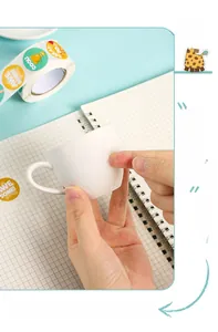 Detail of round cartoon reward sticker with Awesome text applied to a ceramic cup