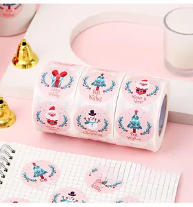 Detail of Christmas snowman stickers on a notebook with warm festive decorations