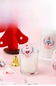 Pink Christmas labels with snowmen and trees for gift wrapping and holiday seals