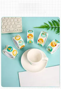 Detailed view of five rolls of colorful cartoon reward stickers with encouraging words