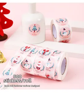 Detail view of 500pcs pink Merry Christmas sticker roll with festive snowman and Santa patterns