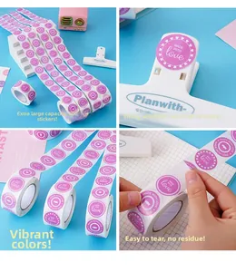 Detail of round purple 'Made with Love' stickers on roll for Valentine gift wrapping