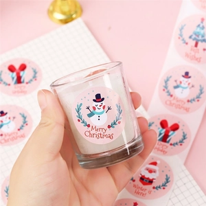Pink cartoon snowman Merry Christmas stickers applied on glass for gift decoration