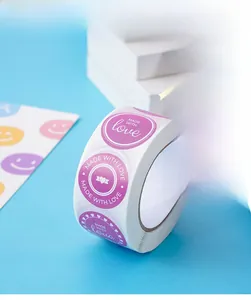 Macro detail of round Made with Love stickers on a roll for gift packaging decoration
