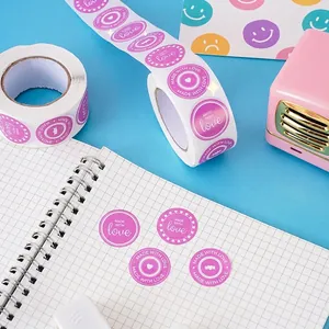 Pink heart-shaped Made With Love round labels on a roll for gift wrapping and envelopes