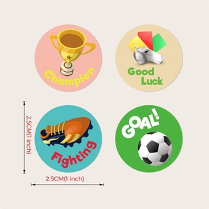 Close-up of soccer reward stickers showing champion cup and football motifs, 2.5cm diameter