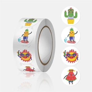 Detail view of round cartoon fruit stickers on a roll for kids decoration and gift sealing