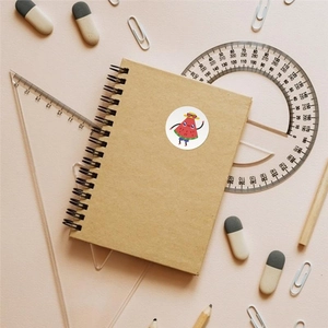 Cartoon fruit stickers with cute watermelon design on notebook with stationery supplies