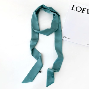 Cyan narrow silk scarf ribbon with soft luster shown on a clean minimalist background