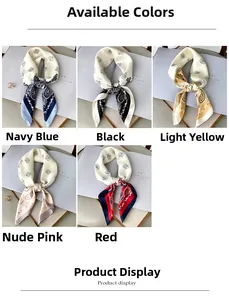 Detailed view of paisley printed square scarves in navy, black, yellow, pink, and red