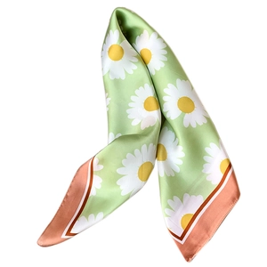 Light green silk scarf with large daisy floral print and polished satin finish