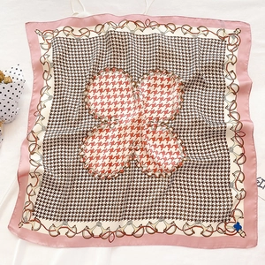 Silk feel square scarf with black white houndstooth pattern and horsebit chain design