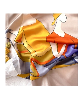 Detail of silk scarf showing abstract art print and smooth satin texture with elegant drapes