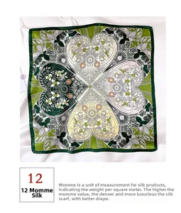 Detailed view of 12 momme silk scarf featuring heart-shaped clover floral patterns