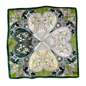 Elegant floral silk square scarf in green with intricate heart-shaped clover leaf patterns