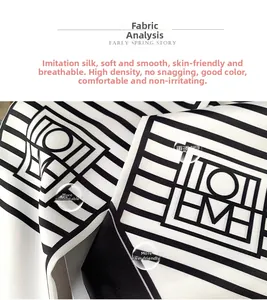 Close-up of geometric black and white striped silk scarf showing high-density texture