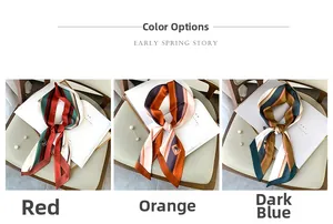 Detailed view of striped narrow silk scarves in red, orange, and dark blue silk fabric